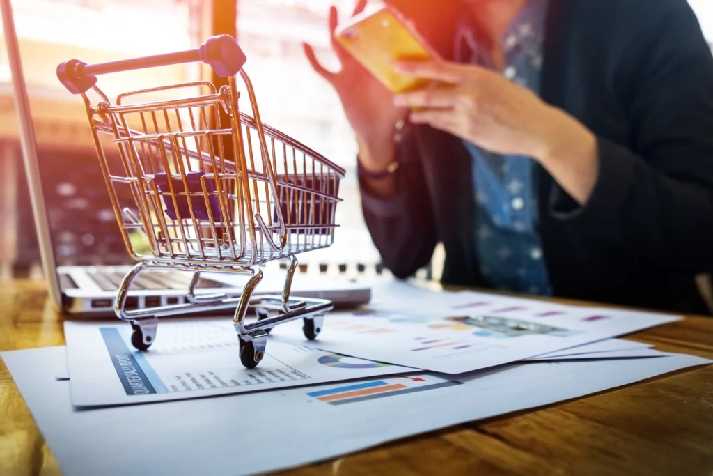 cropped image woman inputting card information key phone laptop while shopping online cropped image woman inputting card information key phone laptop while shopping online