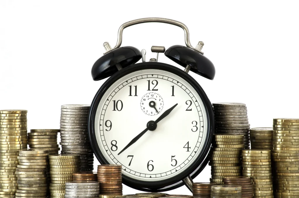 time is money concept alarm clock lots euro coins time is money concept alarm clock lots euro coins