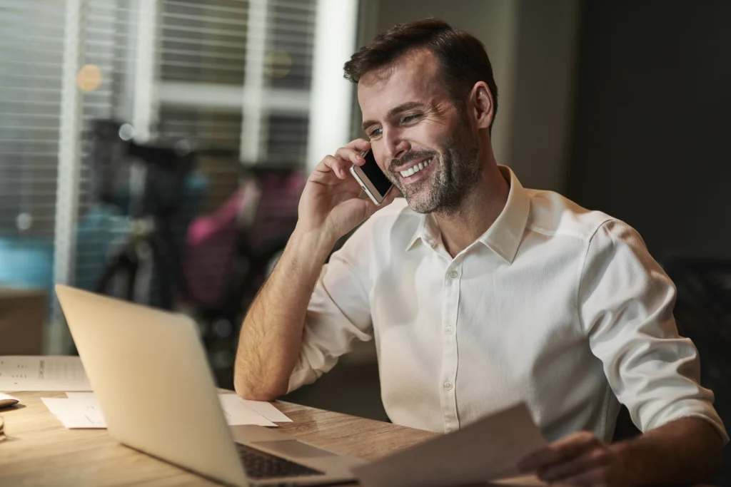 smiling businessman talking by mobile phone smiling businessman talking by mobile phone