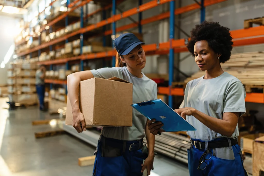 african american worker her coworker reading order list before shipment while working warehouse african american worker her coworker reading order list before shipment while working warehouse