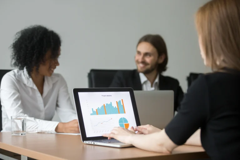 businesswoman working with project statistics preparing report team meeting