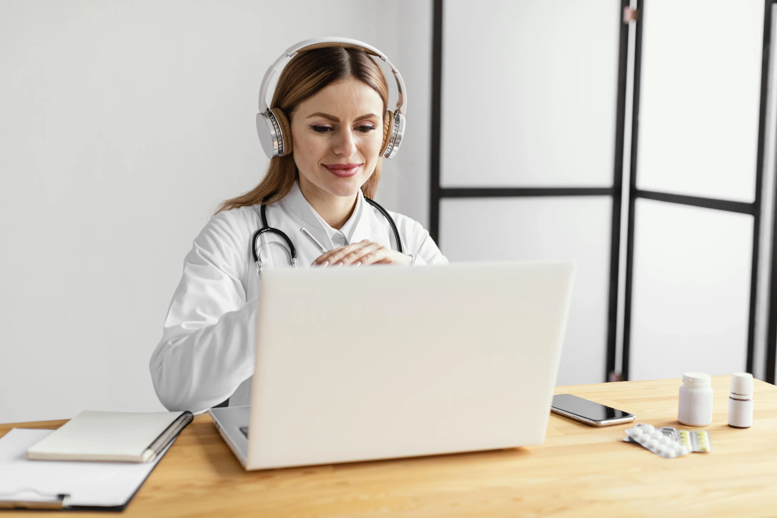 medium shot doctor desk scaled medium shot doctor desk scaled
