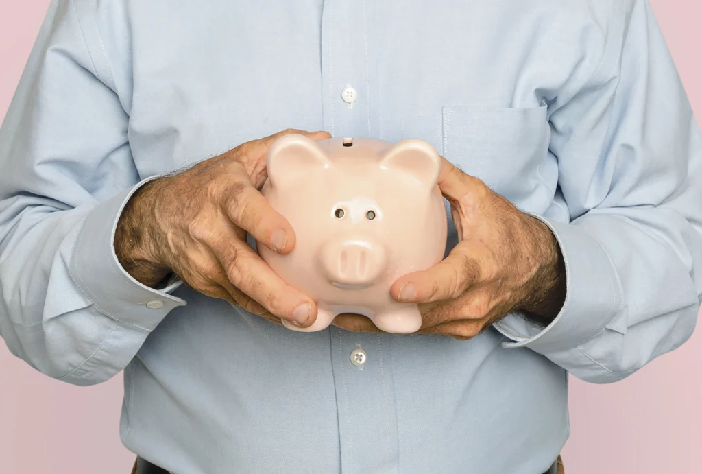 senior man holding piggy bank financial savings campaign senior man holding piggy bank financial savings campaign