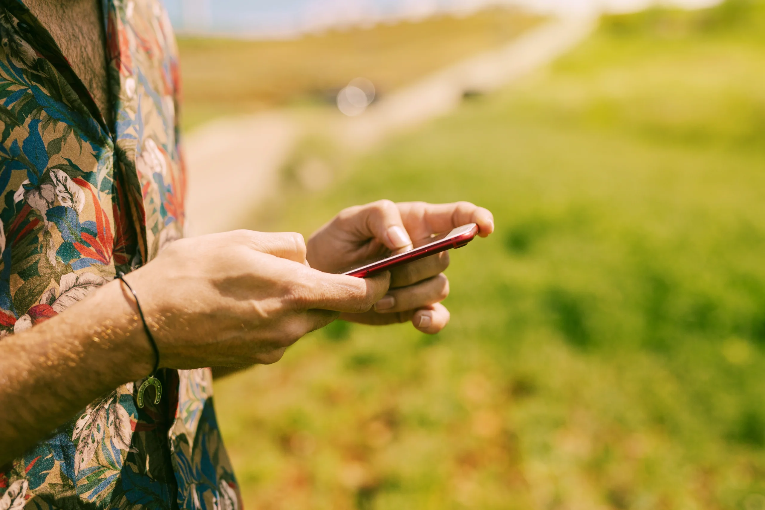 man holding smartphone nature scaled man holding smartphone nature scaled