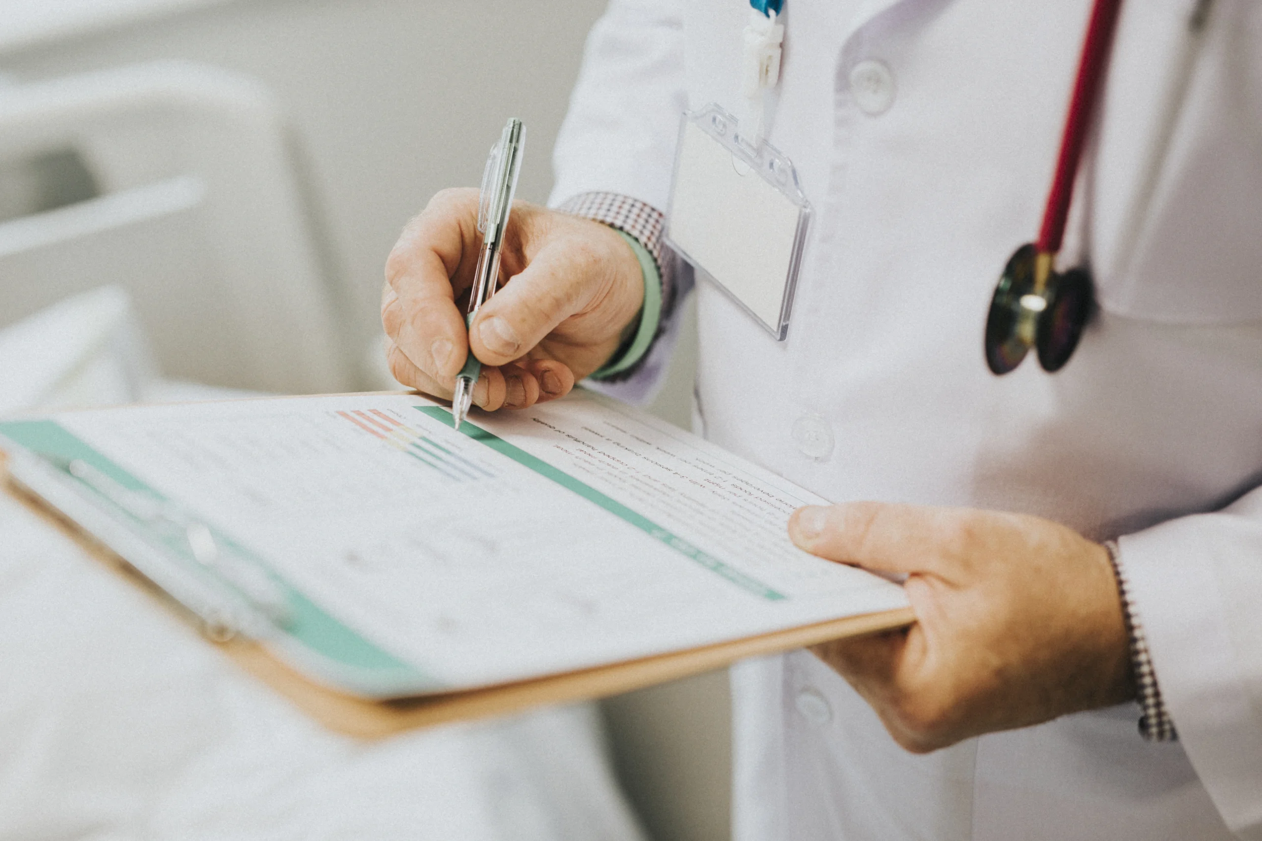physician noting down symptoms patient scaled physician noting down symptoms patient scaled