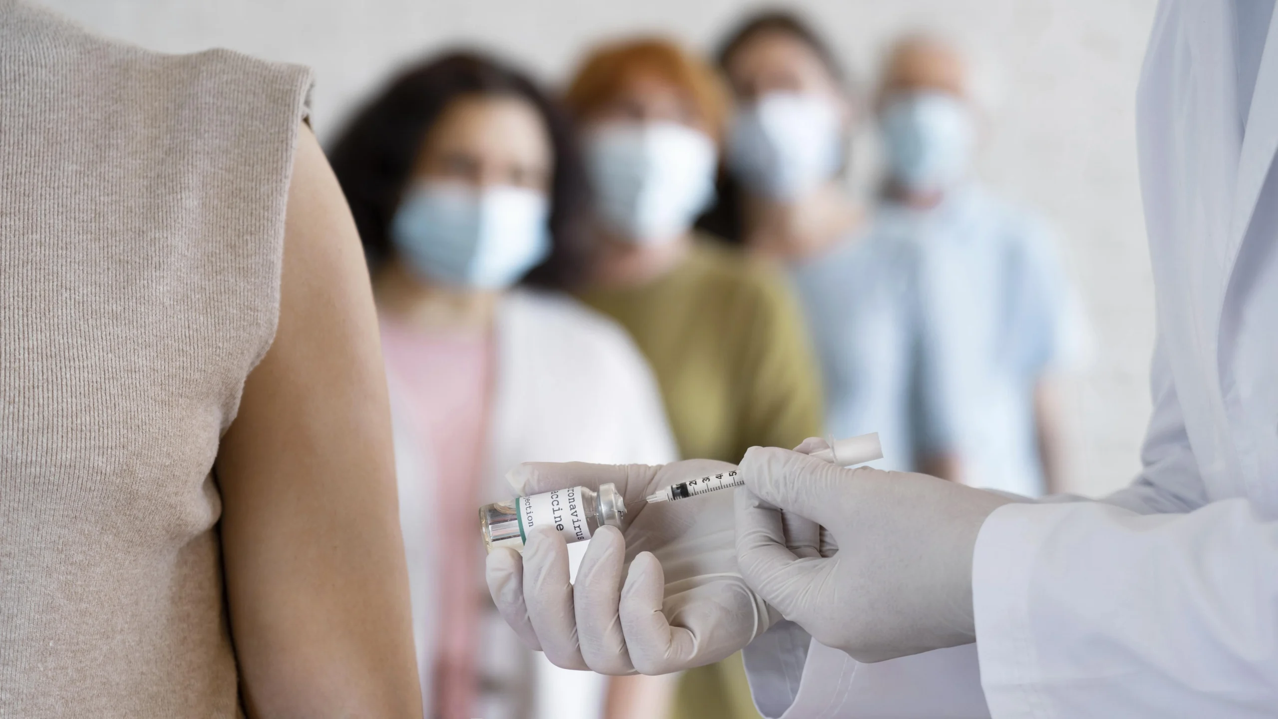 woman getting vaccine shot by doctor scaled woman getting vaccine shot by doctor scaled