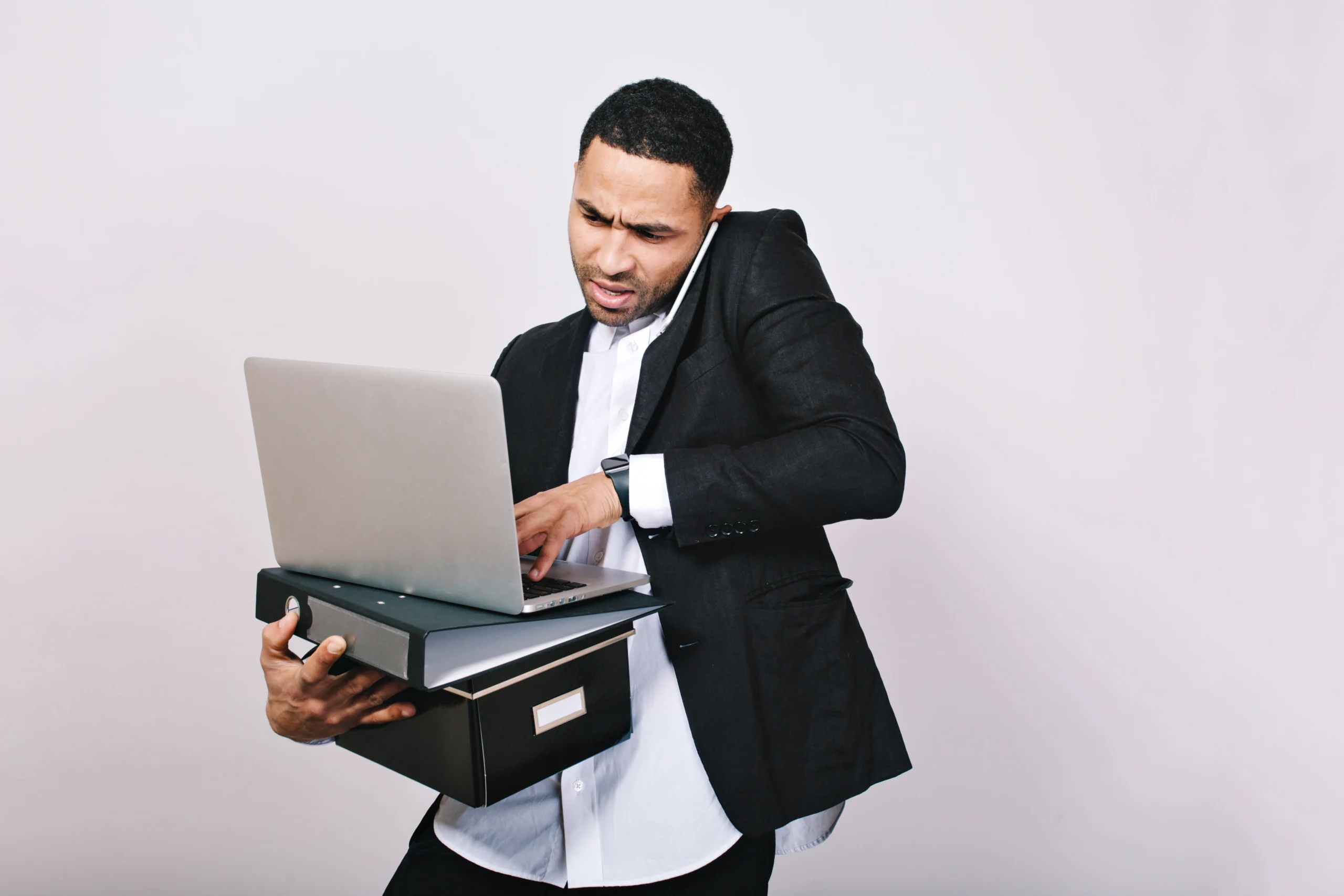 portrait busy hard working astonished businessman with office folders laptop talking phone office worker career misunderstanding smart handsome man scaled portrait busy hard working astonished businessman with office folders laptop talking phone office worker career misunderstanding smart handsome man scaled