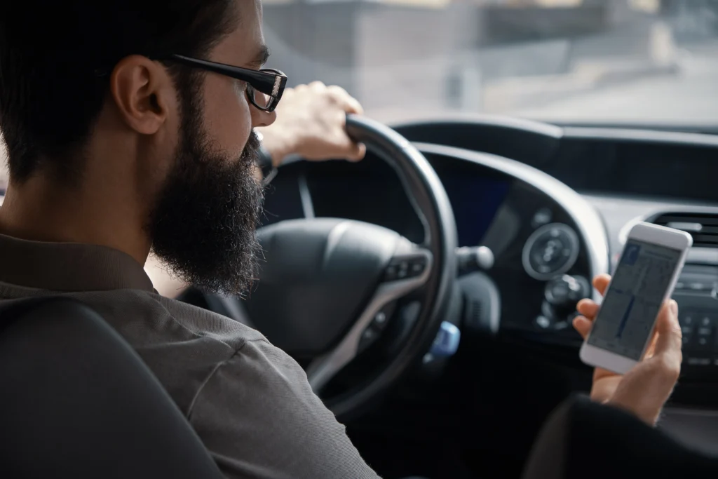 man using mobile phone while driving man using mobile phone while driving