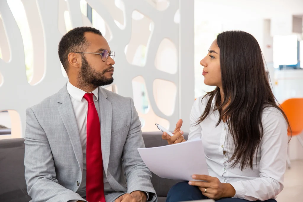 professional young business colleagues discussing contract professional young business colleagues discussing contract