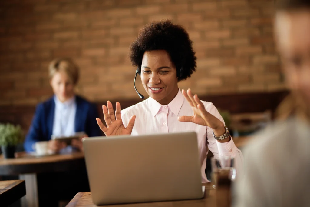 happy black businesswoman making video call laptop cafe happy black businesswoman making video call laptop cafe