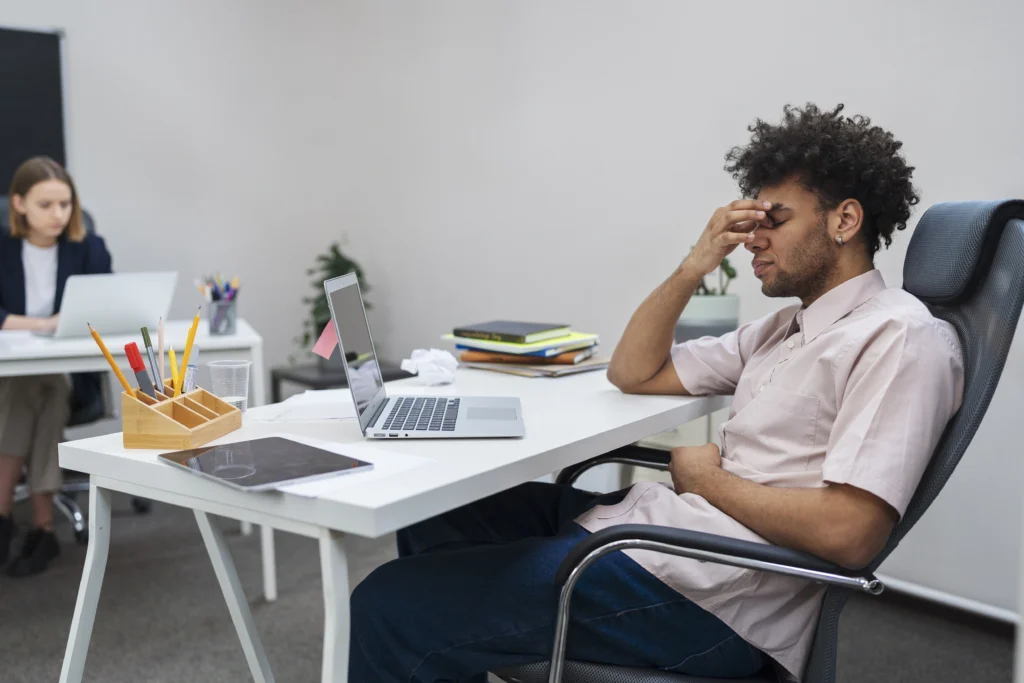 medium shot tired man with laptop work medium shot tired man with laptop work